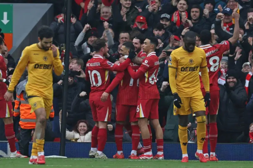 Liverpool extends their lead to seven points after defeating Wolves 2-1.