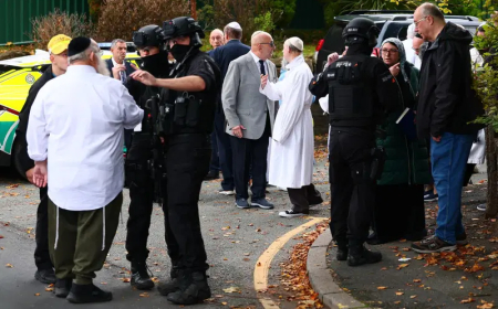 Four wounded, suspect shot in Manchester synagogue attack
