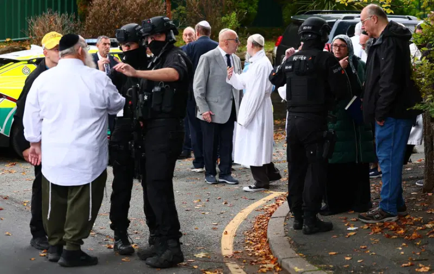 Four wounded, suspect shot in Manchester synagogue attack