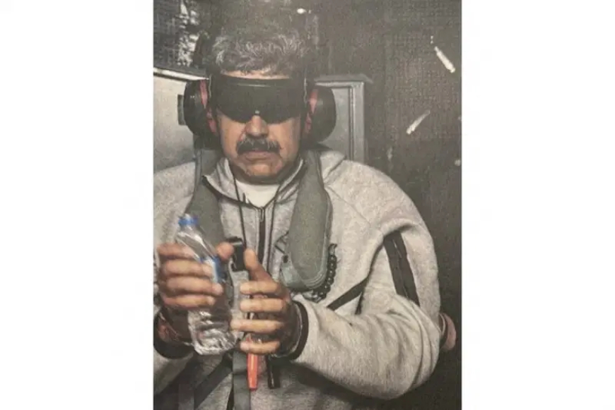 Trump posts photo of handcuffed, blindfolded Maduro