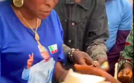 Osun woman shares rice, urges residents to vote APC candidate